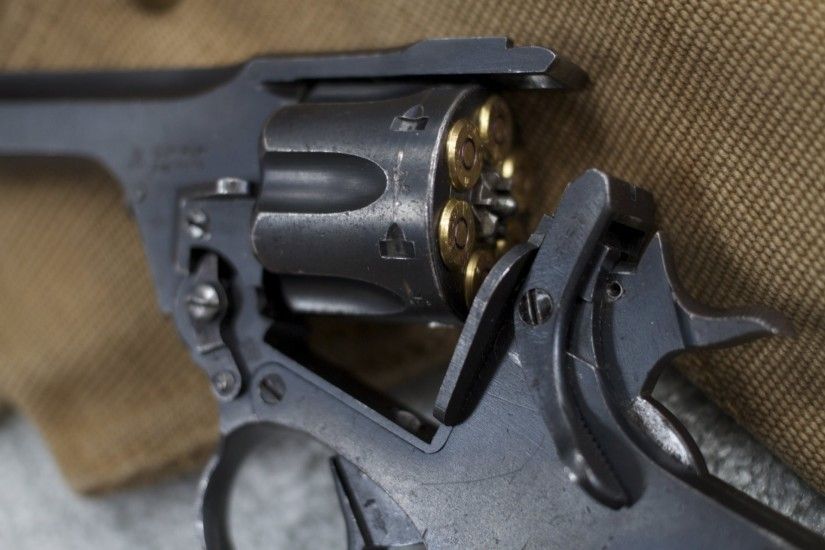 webley & scott revolver weapon close up cartridges