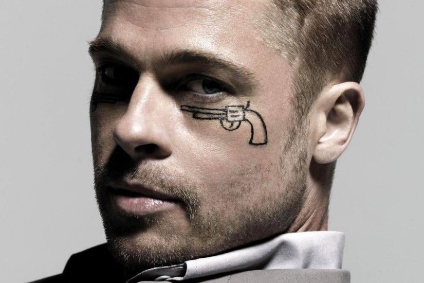 Brad Pitt with a pistol drawn under his eye wallpaper