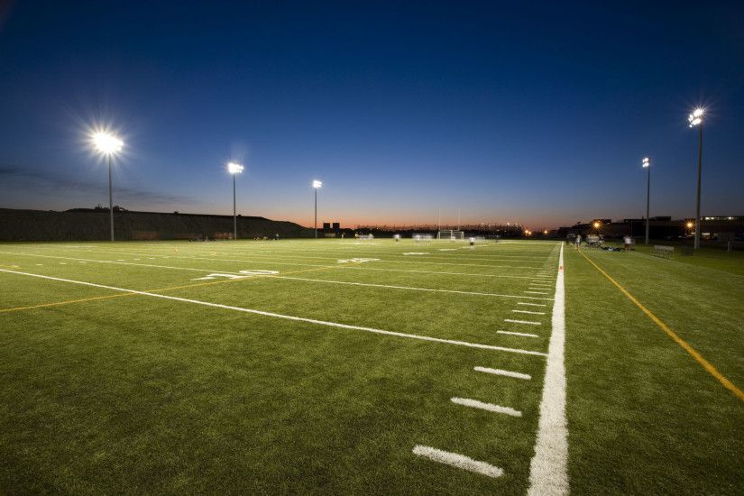 Football Field Lights At Night Land on new home field