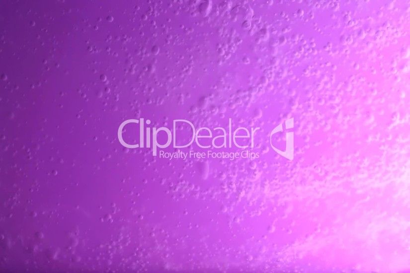 Clips. Water spreading on purple background ...