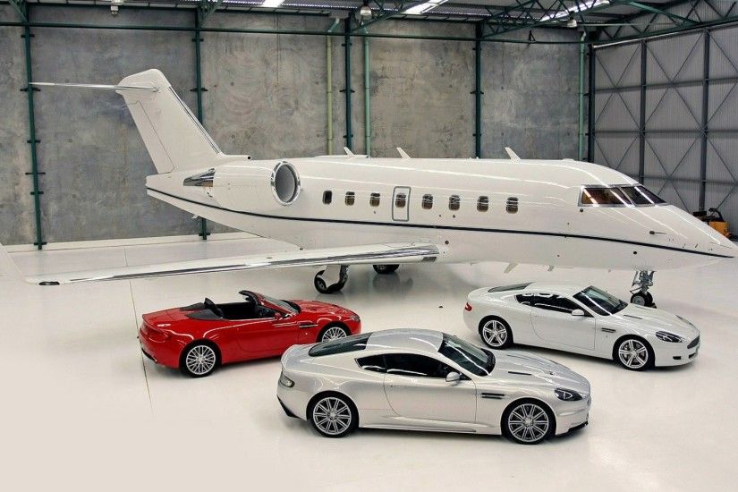 Cars Aston Martin in the hangar at a private jet