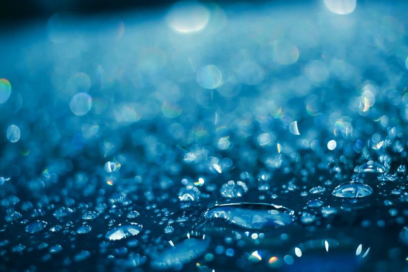 Water drops on glass after rain. Water droplets on glass in blue color.  Shiny