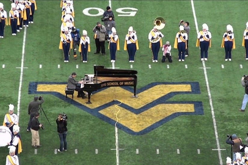 "Country Roads" - WVU Marching Band featuring James "Doc" Miltenberger -  YouTube