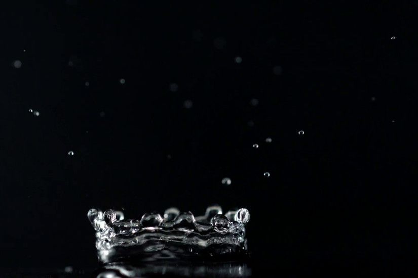 Water drop making splash on black background, Slow Motion Stock Video  Footage - VideoBlocks