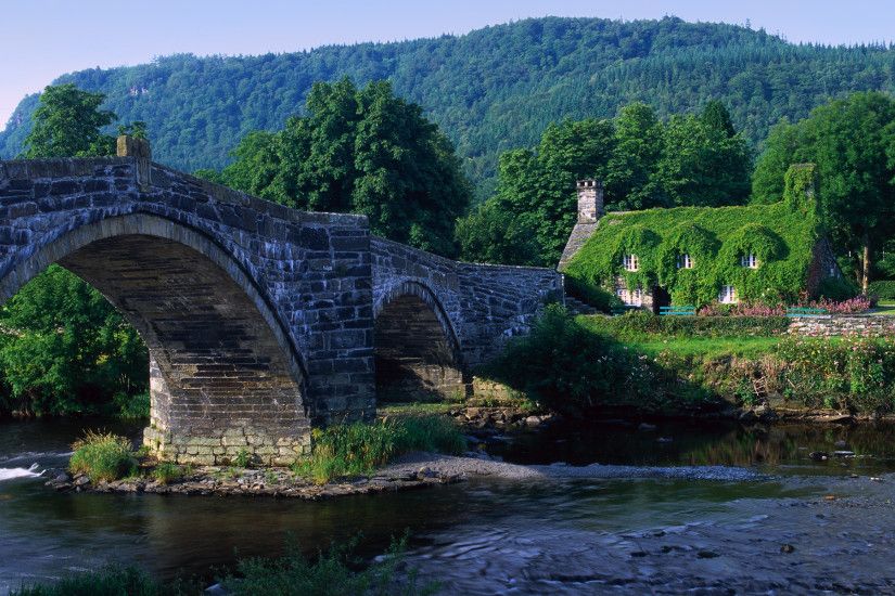 Arch Bridge and Moss Covered House, Wales, UK. I have picture of my  daughter here!