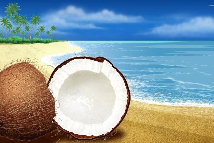 Coconut cut in half on the beach wallpaper