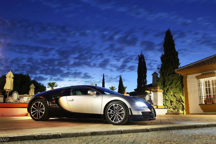 bugatti veyron in front of a mansion at sunset wallpaper