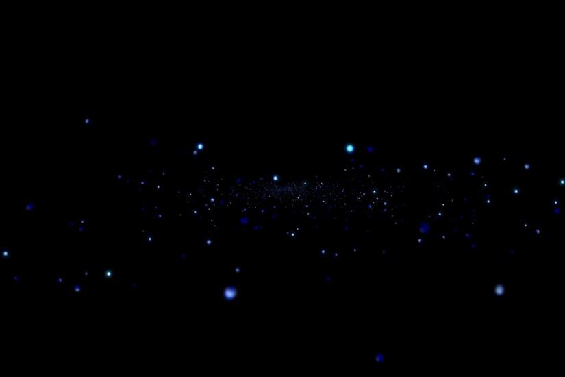 Blue glitter particles rise up and shimmer against a black background.  Motion Background - VideoBlocks
