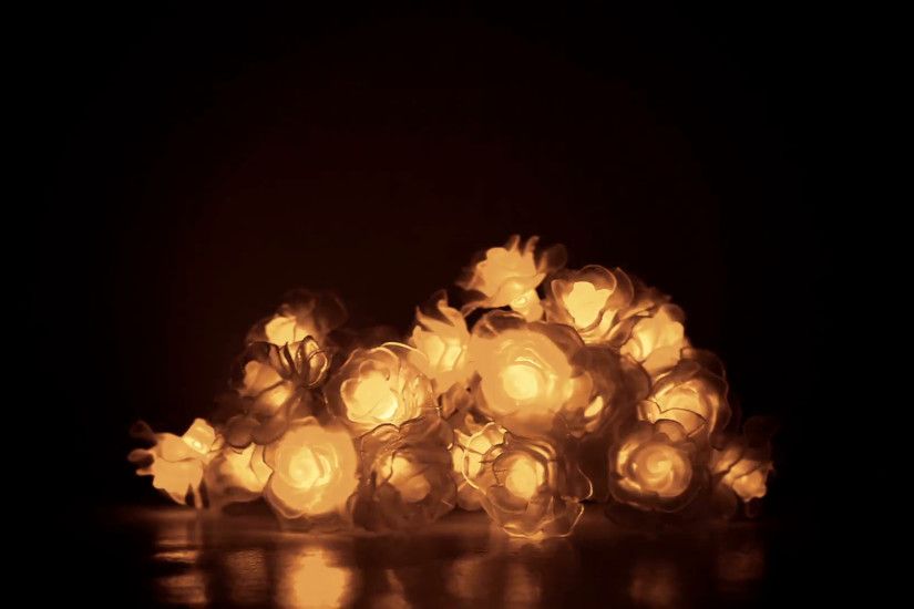 Tangled golden Christmas light bulbs (roses shape) on darkness background -  copy space Stock Video Footage - VideoBlocks