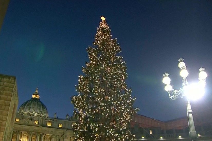 Vatican Christmas tree is lit in St. Peter's Square, adorned with ornaments  made from sick children across Italy and the nativity scene includes a  spire ...
