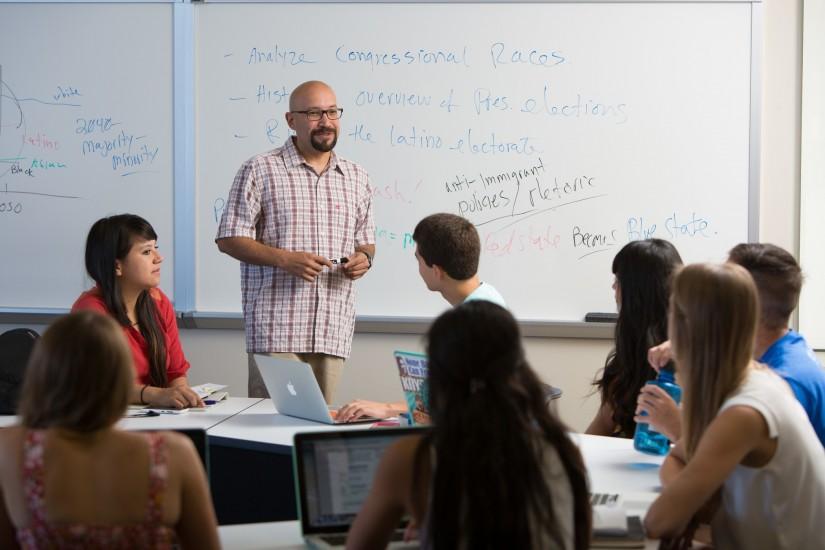 Adrian Pantoja, professor of Political Studies and Chicano studies,  teaching in the classroom with