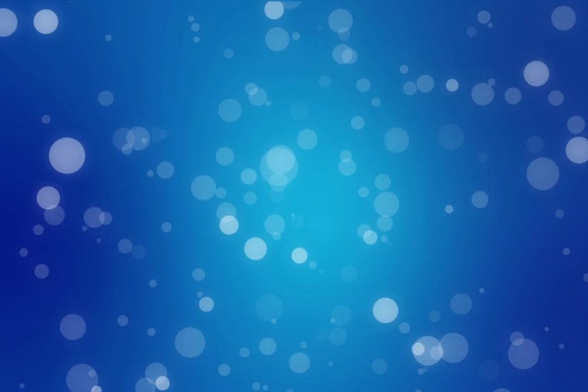 Glowing abstract Christmas holiday background with white bokeh lights  flickering on dark blue gradient backdrop
