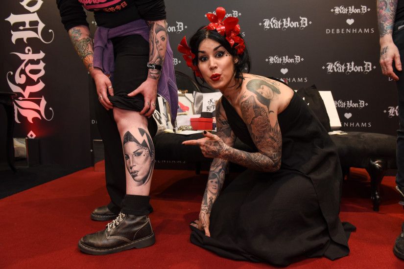 A guest at the UK launch of Kat Von D Beauty at Debenhams shows off his