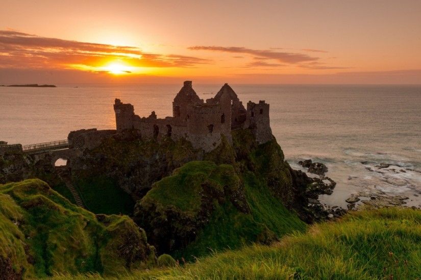 dunluce castle the irish sea ireland sunset ruins coast lock sea ireland  dunluce castle rock the
