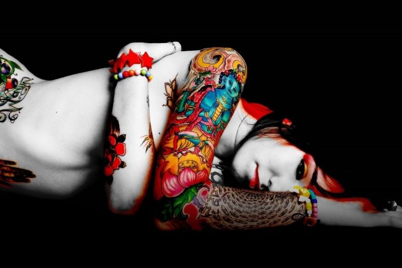 Woman with colorful tattoos wallpaper