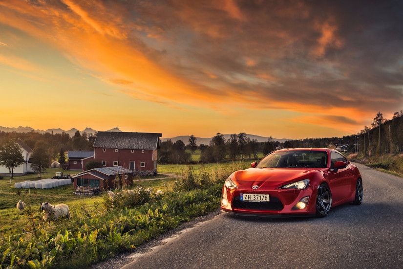 Red Toyota GT86 on a rural highway