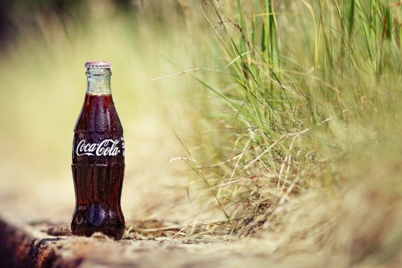 sand grass plants a bottle cola drops coca-cola coca-cola drink soda  background