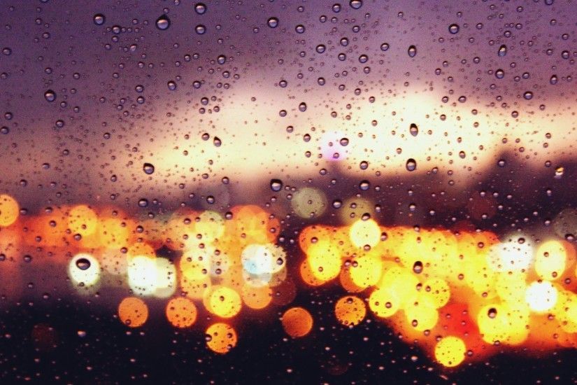 City Lights Behind The Rainy Window