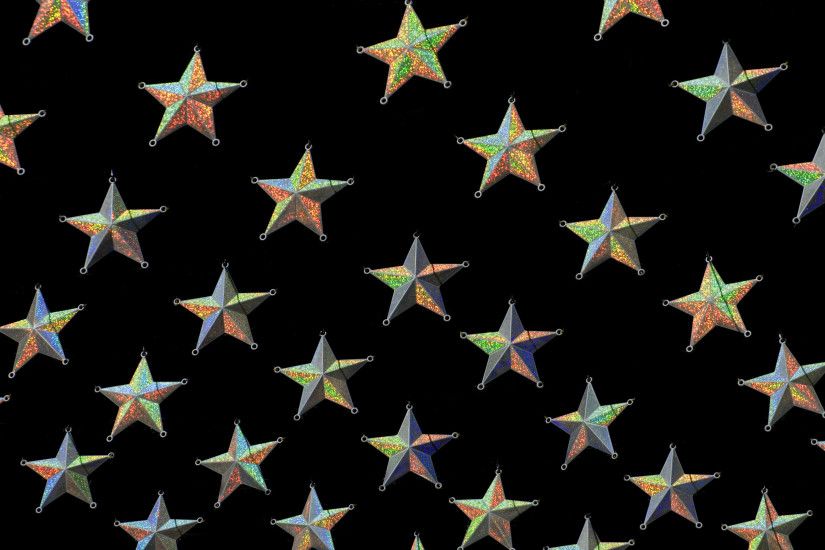 Gold star Christmas background with diagonal rows of stars on a black  background