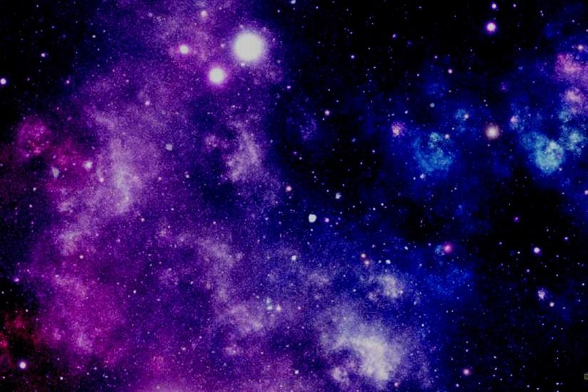 Dark galaxy wallpaper with stars and purple blue nebula.