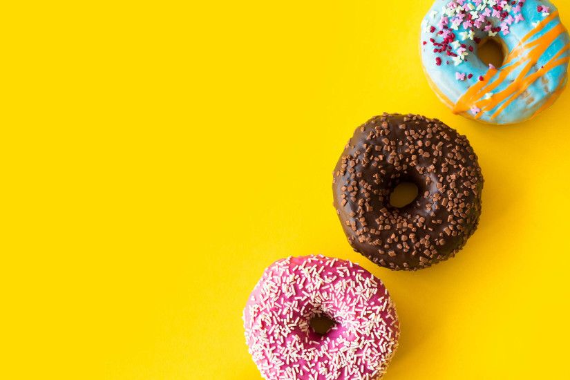 Download Yummy Donuts on Yellow Background Free Stock Photo