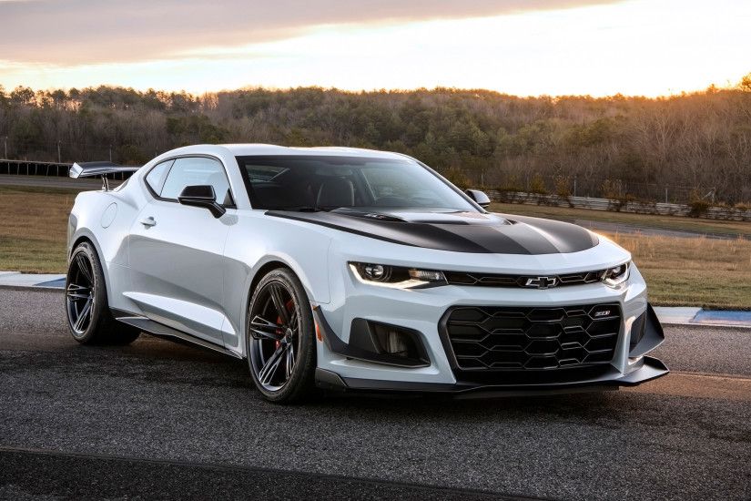 Car Chevrolet Camaro ZL1 on the background of the setting sun