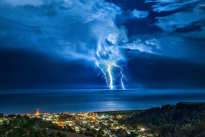 Thunderstorm over the coastal town wallpaper