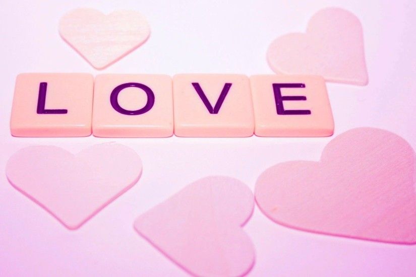 Pink Hearts on Pink Background with the Letters L O V E