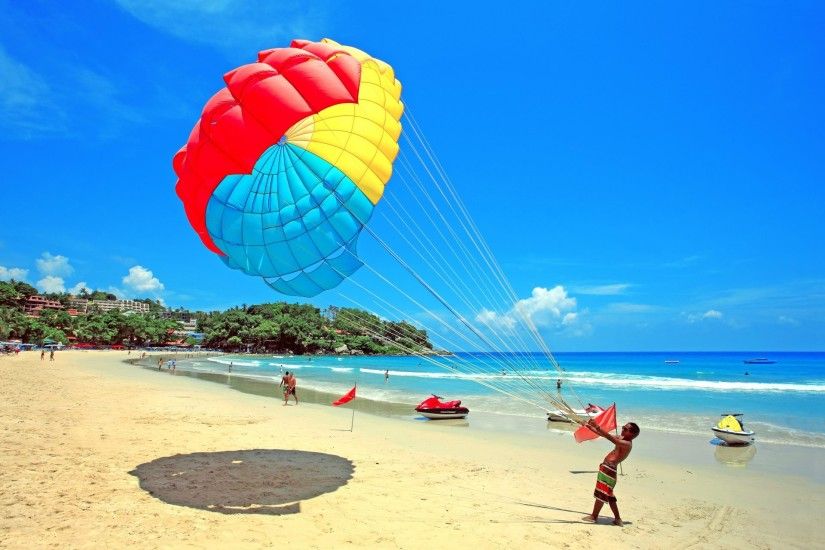 sky clouds beach parachute jet resort people sea