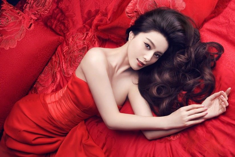 Women beds asians pillows red dress curly hair lying down wallpaper