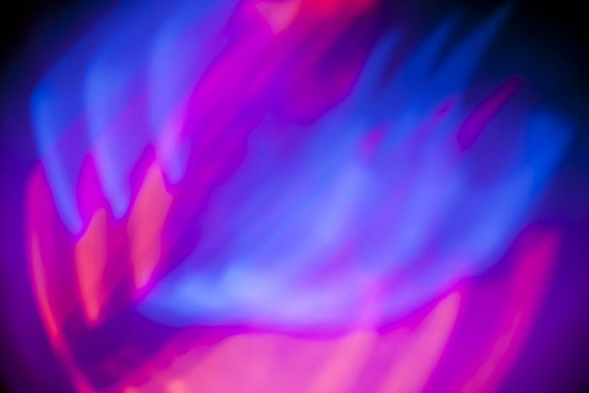 abstract flame like red and blue background of mixing light beams