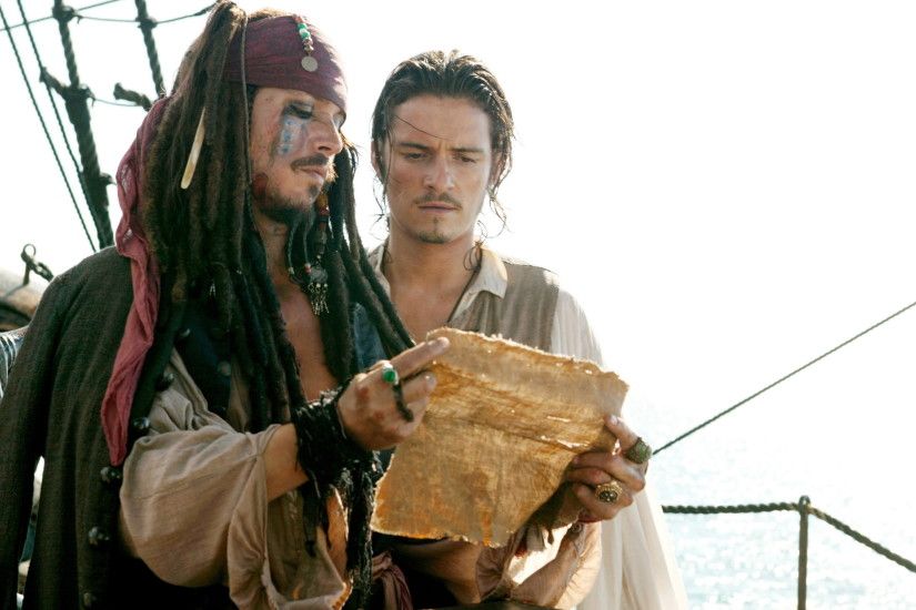 Movie - Pirates Of The Caribbean: Dead Man's Chest Johnny Depp Jack Sparrow  Orlando Bloom