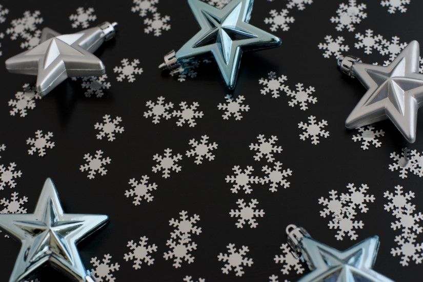Christmas star background with scattered winter snowflakes forming  copyspace for your greeting or message