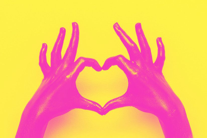 pink-hands-heart-sign-yellow-background-shutterstock_1038669985