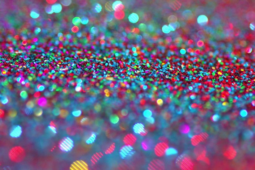 Sparkly glitter background in bright colors. Great party background texture