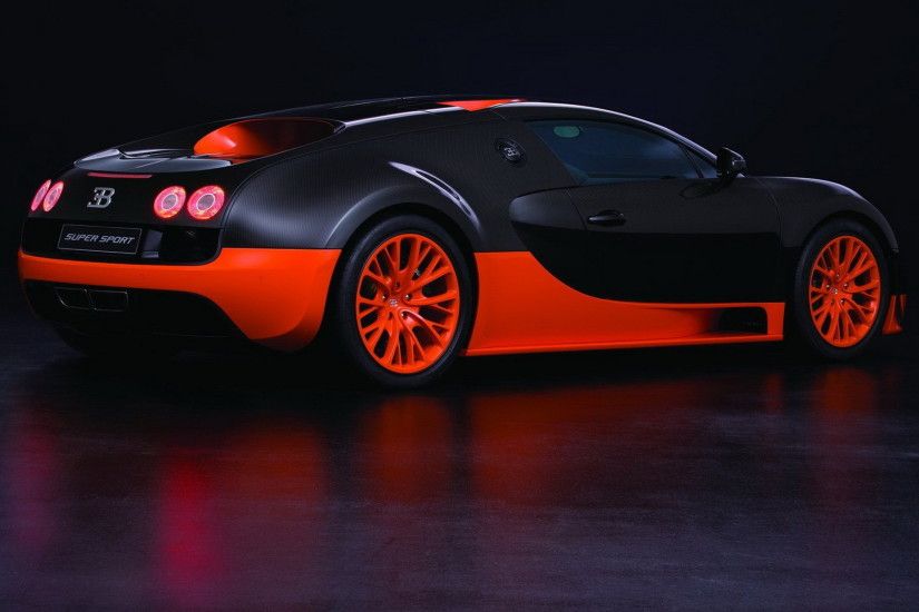 New orange and black Bugatti Veyron Super Sport on a black background