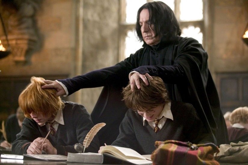 PHOTO: Alan Rickman (standing), Rupert Grint and Daniel Radcliffe (right),  and are seen in a still from 'Harry Potter and the Goblet of Fire.'