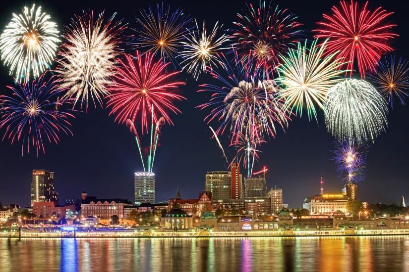 new year fireworks midnight lights building city wallpaper