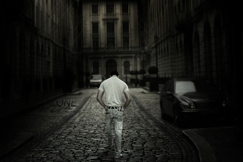 Lonely boy walking in street Photo