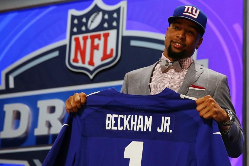 Odell Beckham Jr of the LSU Tigers poses with a jersey after he was .