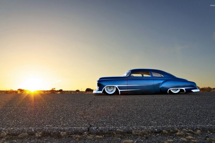 Blue sparkly Chevrolet lowrider side view wallpaper