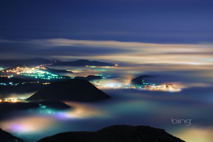 mount datun night image with fog over villages