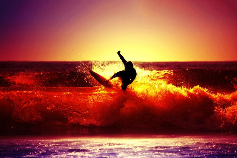 Surfing ocean sunset