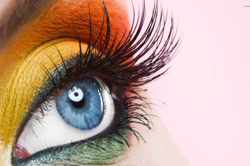 Orange and yellow makeup on the blue eyes wallpaper