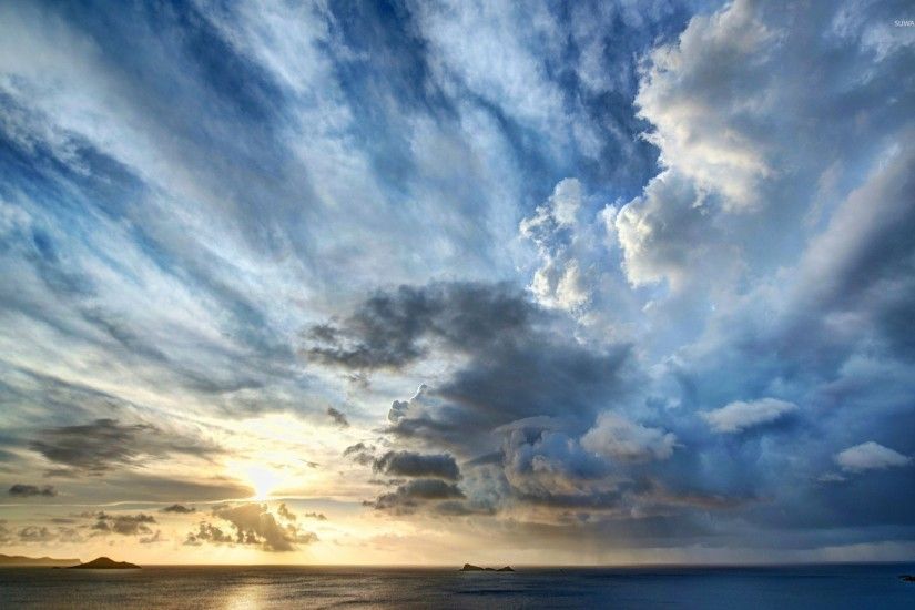 Stormy clouds above the ocean at sunset wallpaper