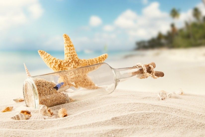 tropics sea beach sand a bottle shells starfish