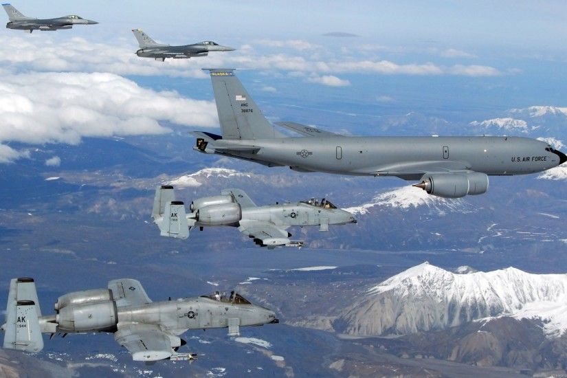 A USAF Boeing Stratotanker refuels some Falcons and some Warthogs.