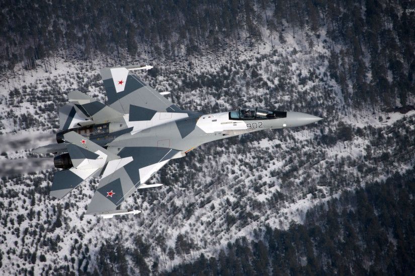 Sukhoi Su-35 above the snowy forest wallpaper