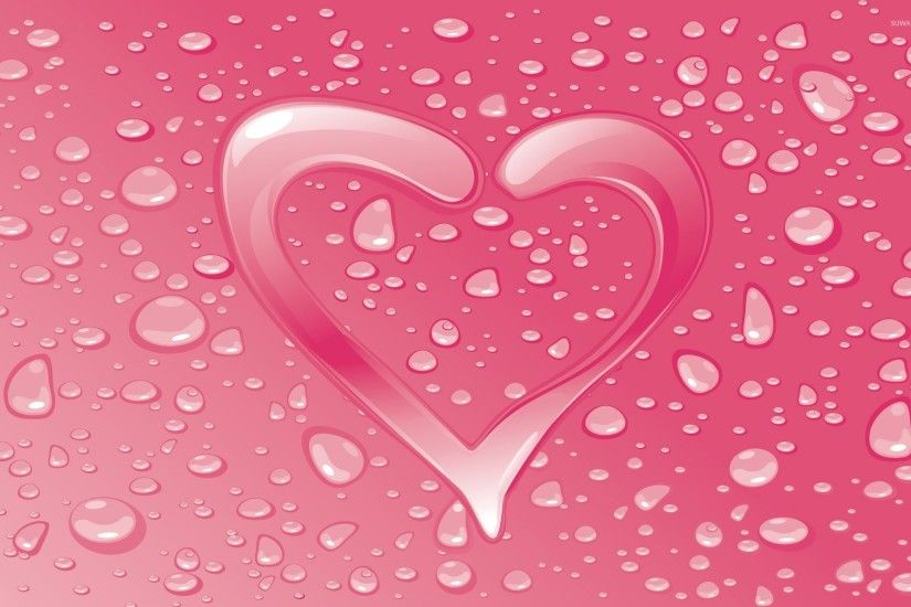 Water drops on the pink heart wallpaper