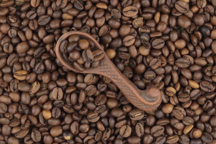 Rotation and zoom of coffee in a clay spoon lying on the background of coffee  beans. Stock Video Footage - VideoBlocks